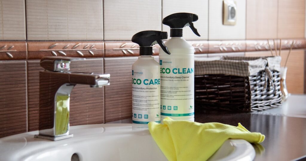 Bathroom cleaning spray bottles on a bright vanity — o2ocleaning best bathroom cleaner Australia